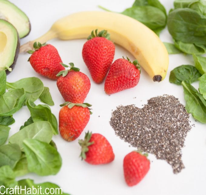 Strawberries, bananas, spinach, avacados and chia seeds to make a spinach smoothie recipe