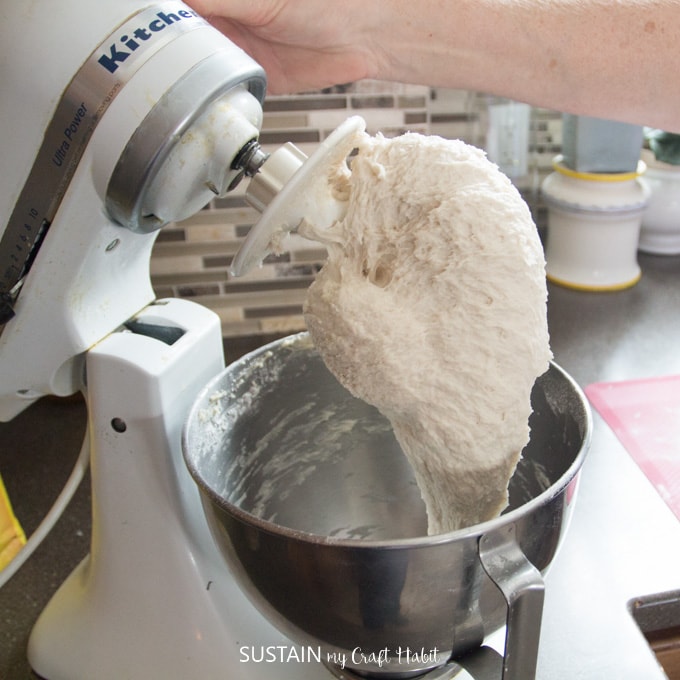 When ready, the blended bread dough will form one ball and pull away from the sides of the mixer bowl wall