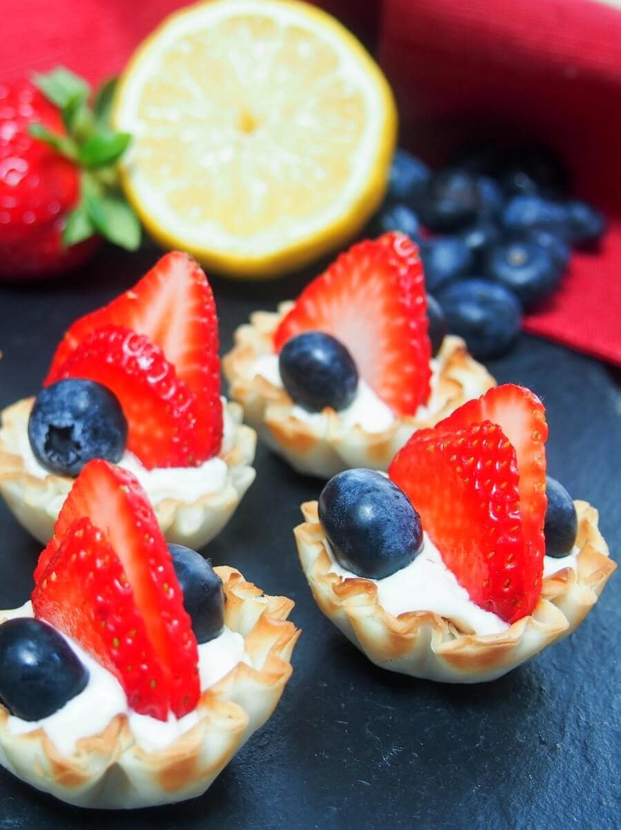 Berry phylo cups filled with fresh strawberries and blueberries