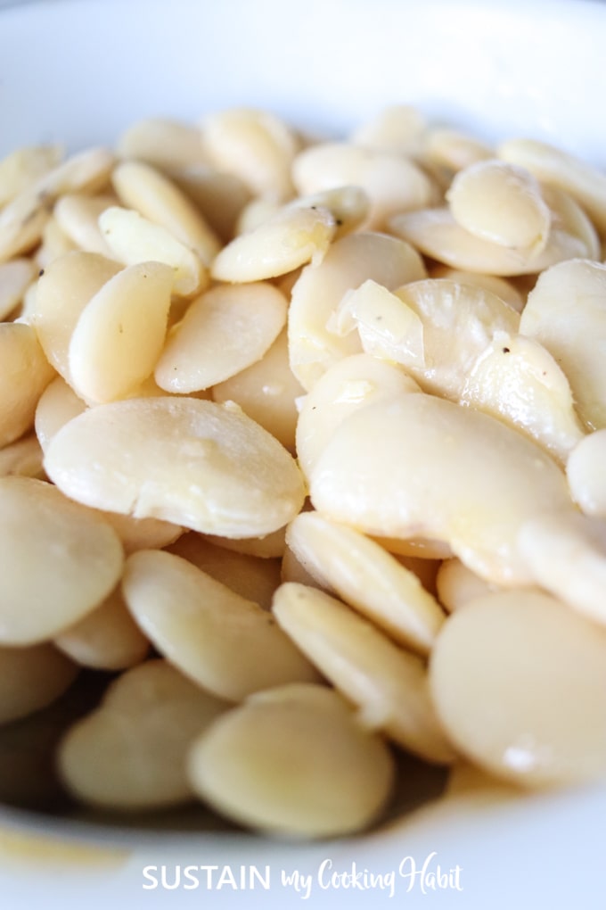 Close up image of cooked lima beans.