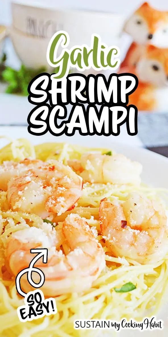 Close up image of cooked garlic shrimp scampi on a bed of spaghetinni pasta. 