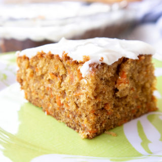 slice of delicious and moist carrot cake with cream cheese frosting