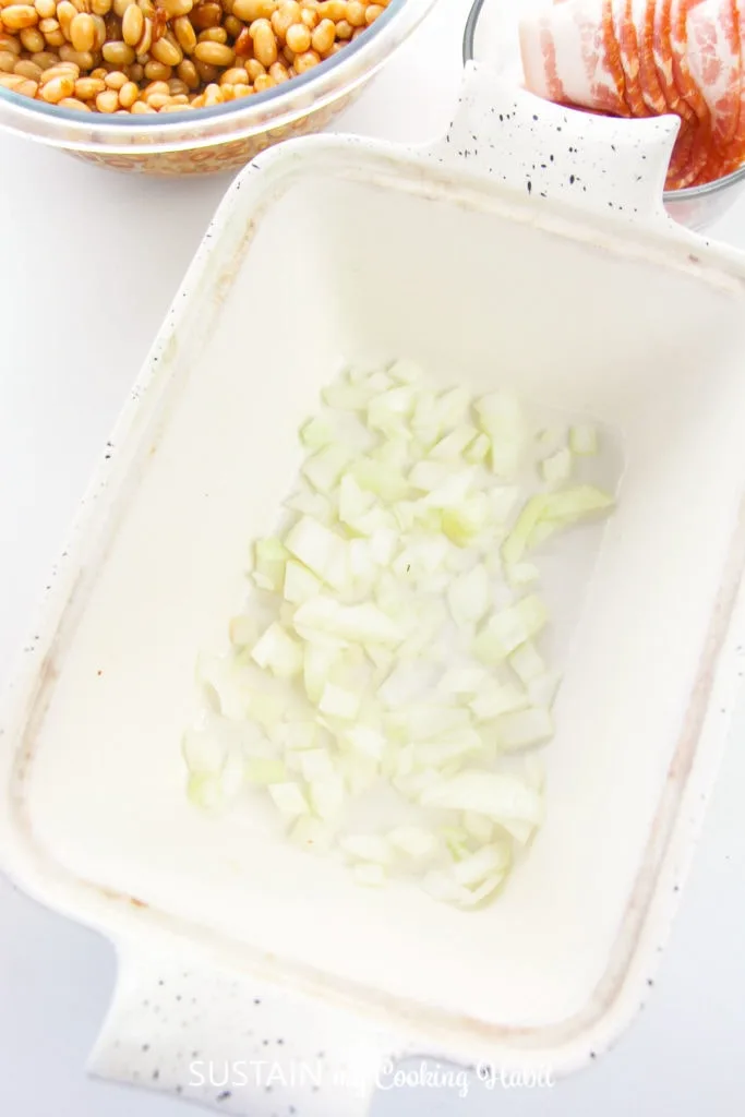 Adding onions to the casserole dish