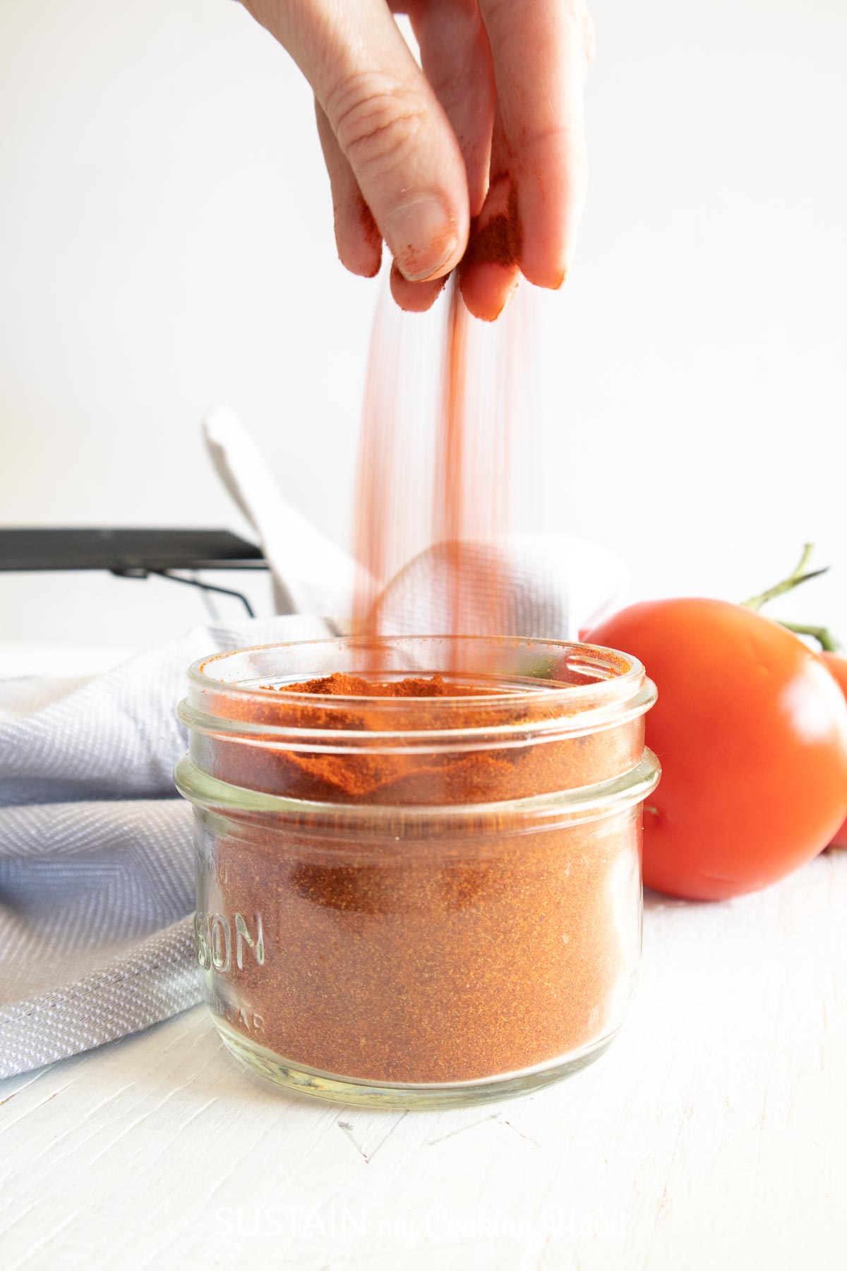 Grabbing a pinch of dried tomato powder.