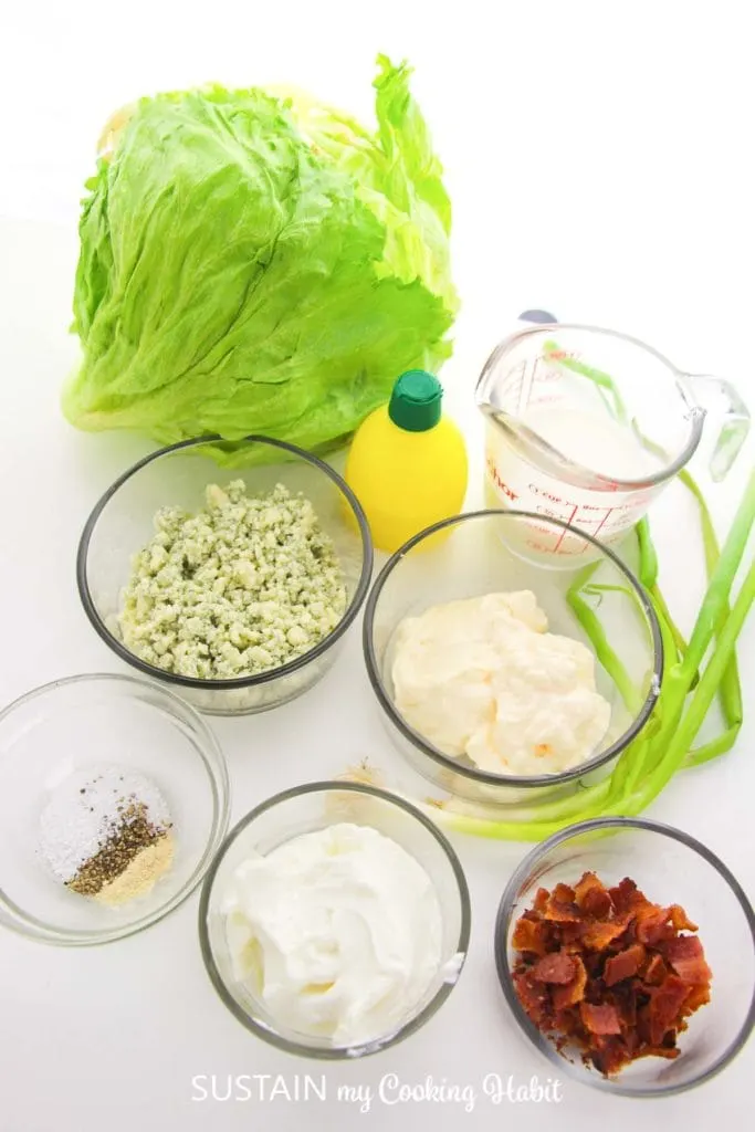 Ingredients in bowls that are needed to make Iceburg wedge salad.