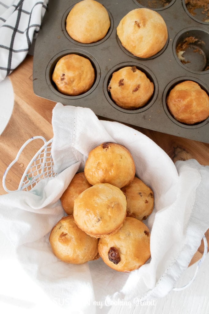 removing sweet bread buns from muffin tins.