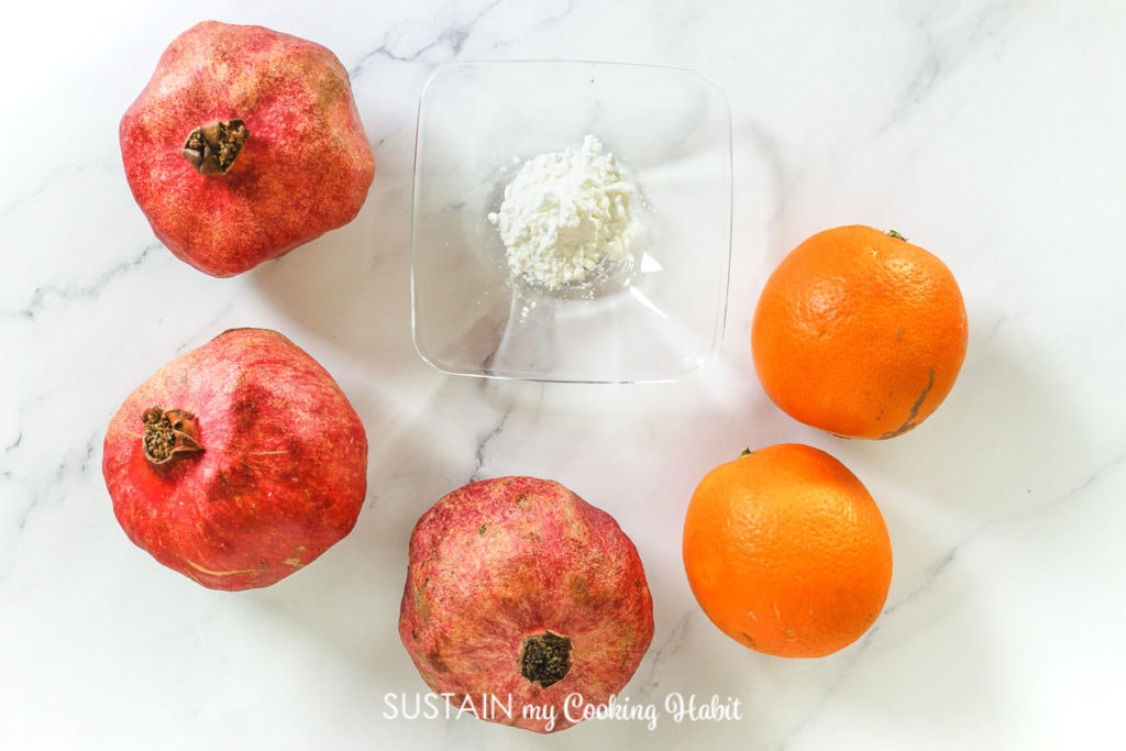Fresh ingredients needed to make Instant pot orange pomegranate jam.