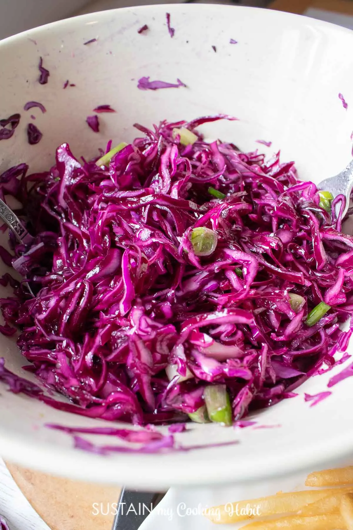 Red cabbage coleslaw in a bowl.