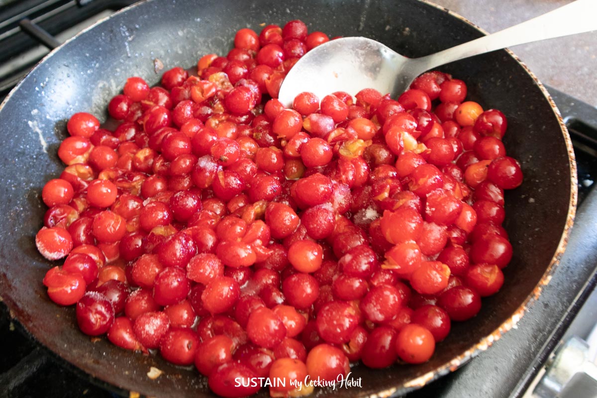 Cooking cherries in a pan.