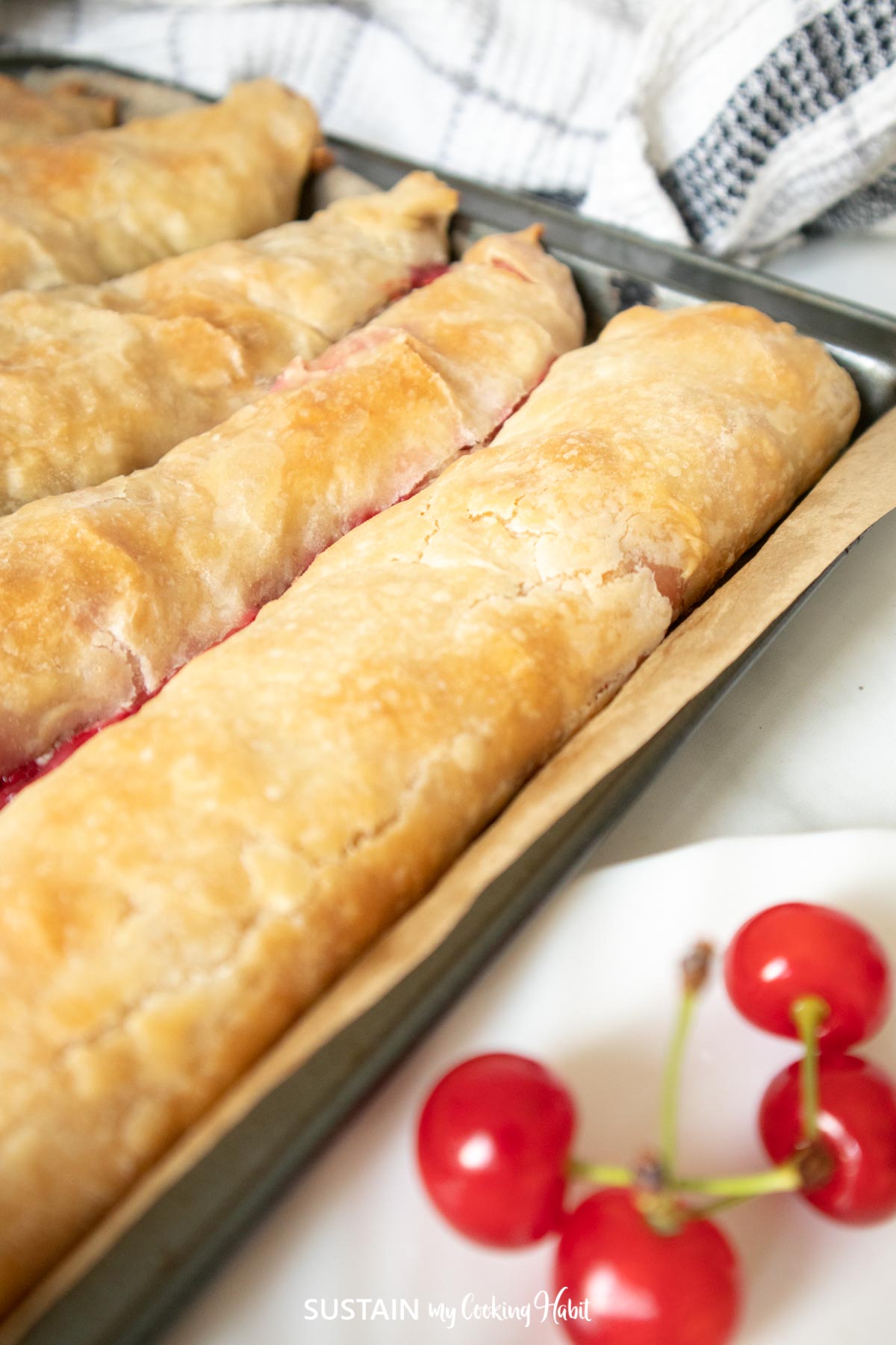 Sour cherry strudel in a pan.