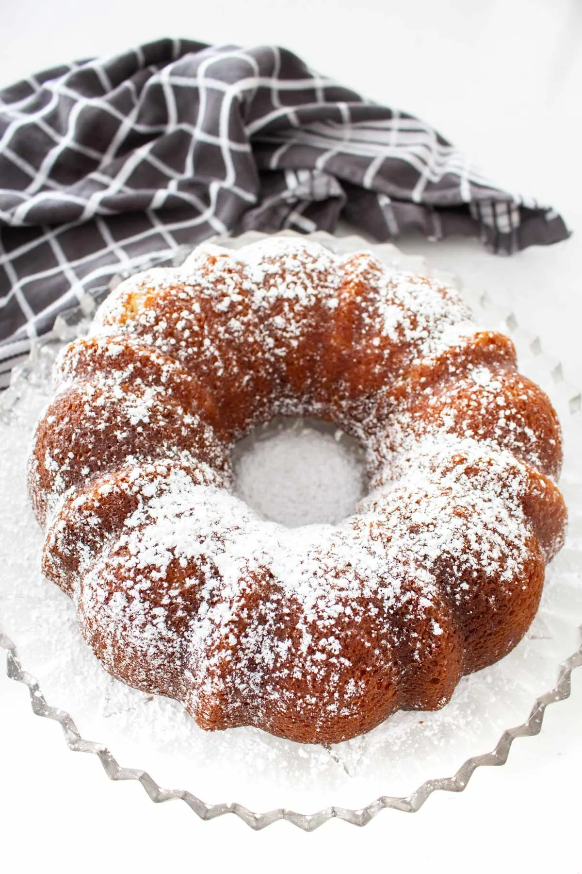Overhead view of a bundt cake sprinked with sugar.