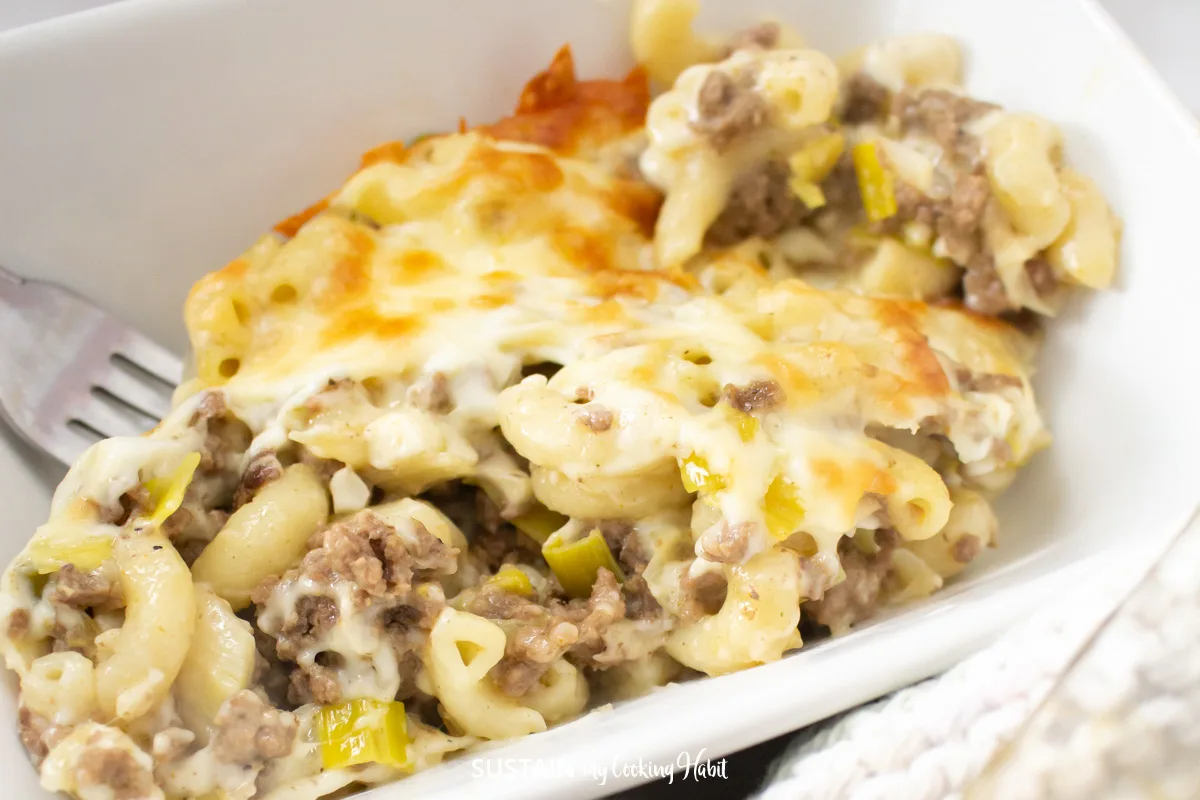 Ground beef and leek casserole on a plate with a fork.