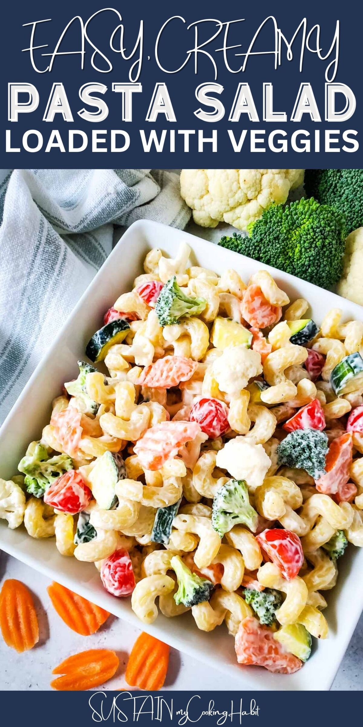 Close up of creamy pasta salad loaded with veggies with text overlay.