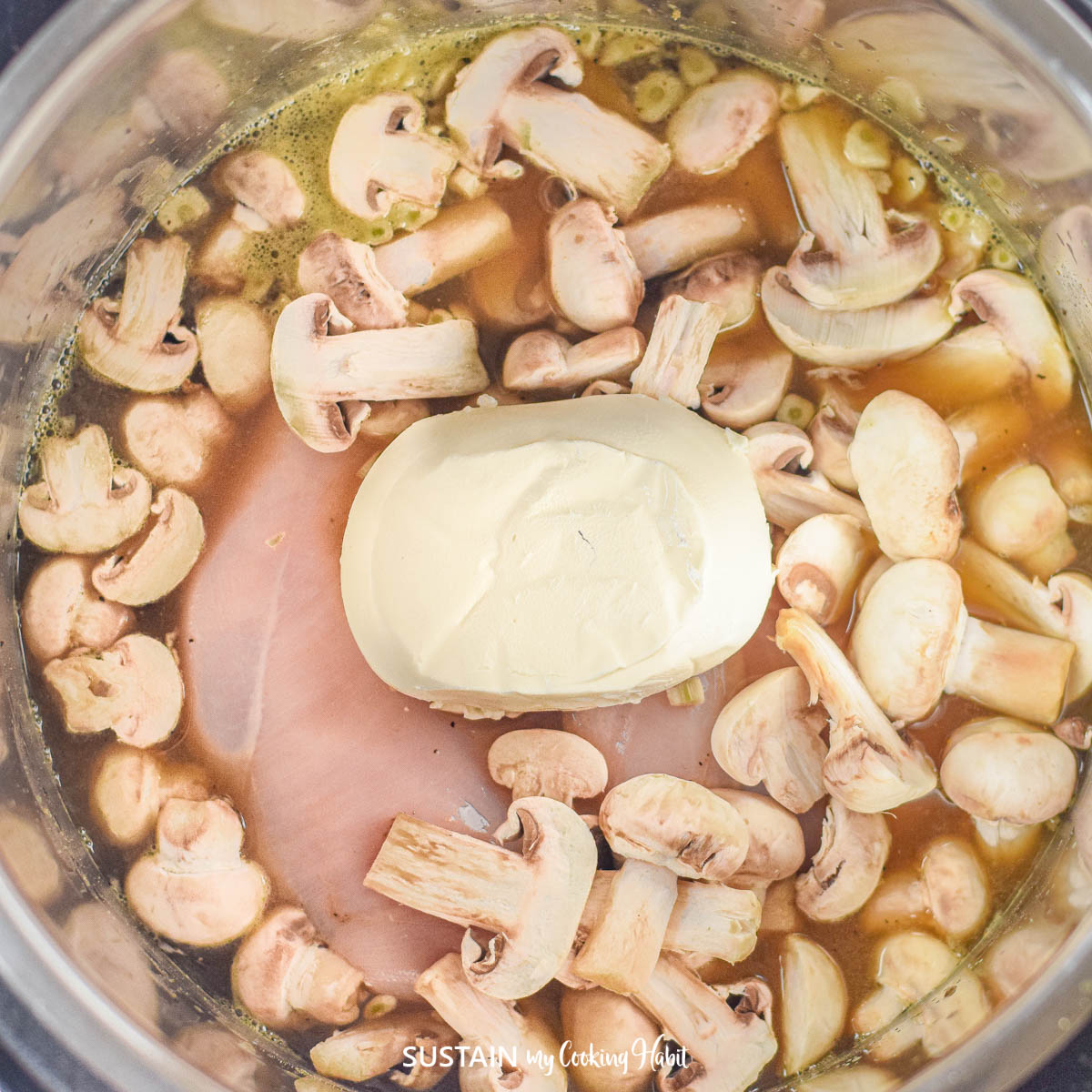 Adding mushrooms and cream cheese into an Instant Pot.