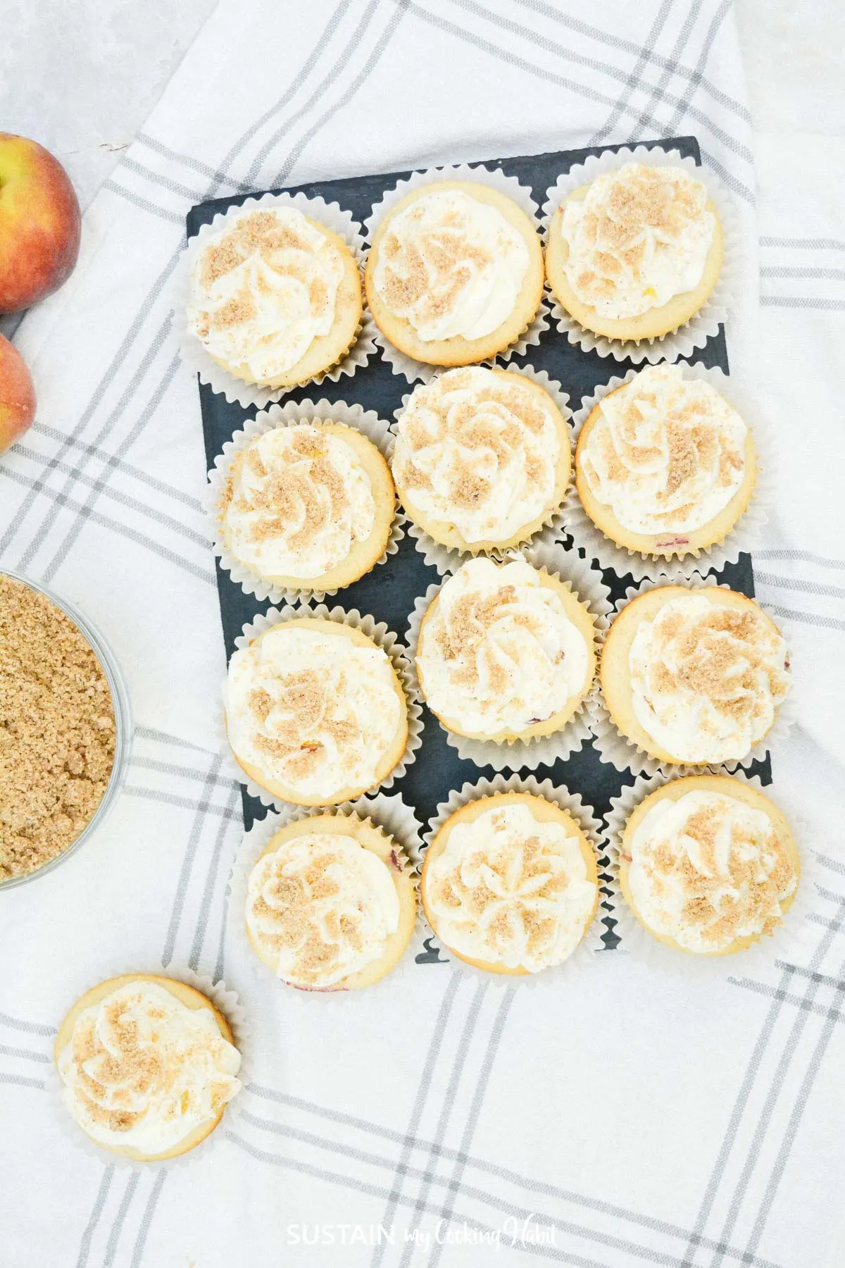 Over head view of frosted peach streusel cupcakes