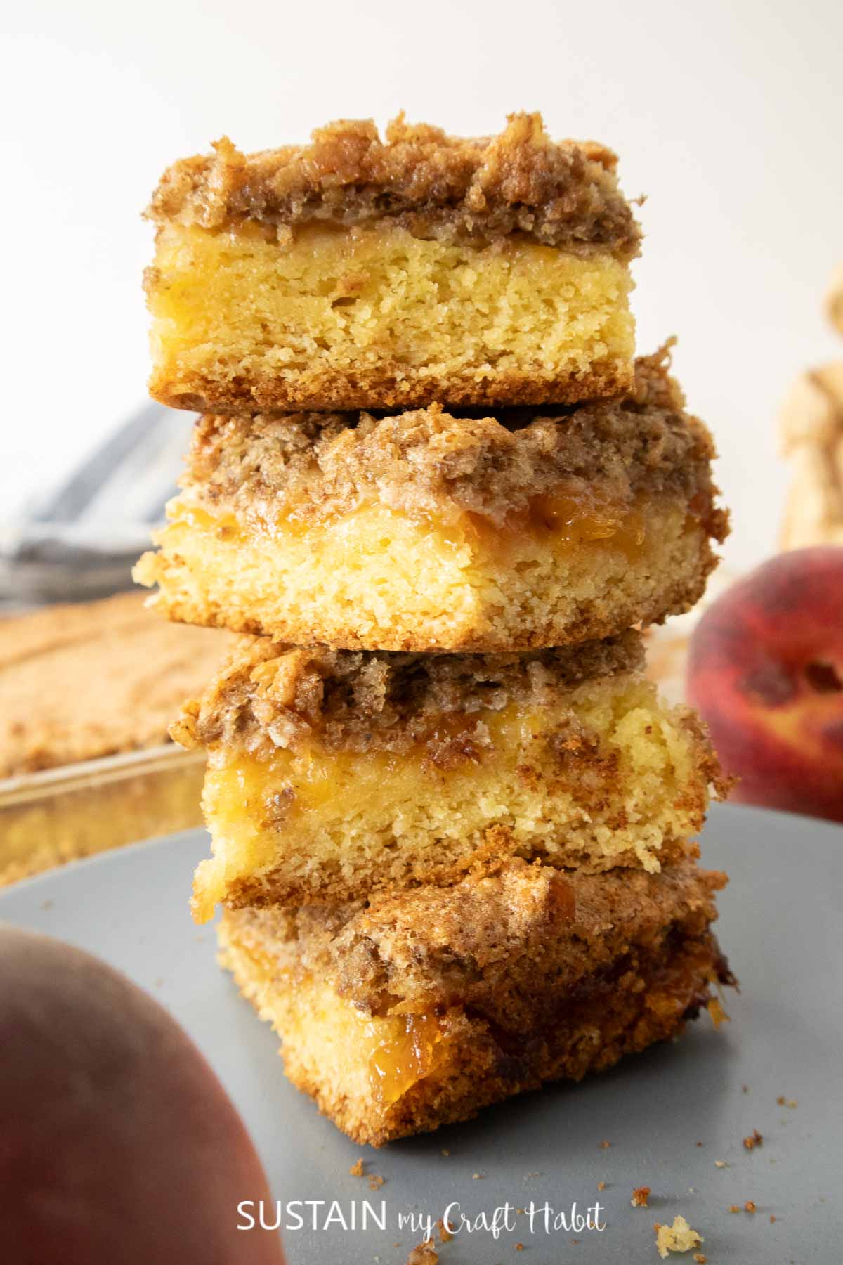 Stacked walnut and peach jam dessert squares.