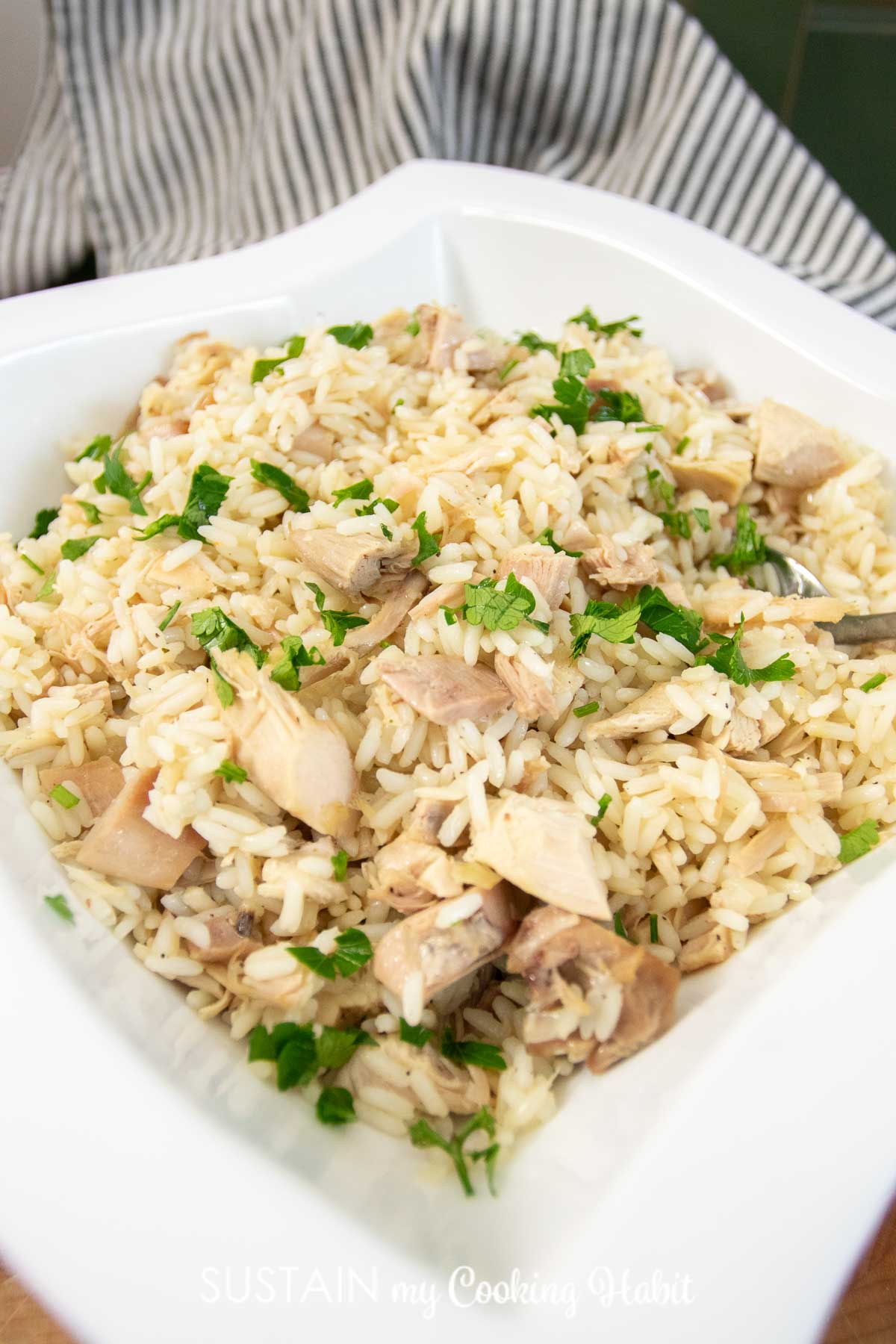 Leftover turkey mixed with cooked rice and garnish.