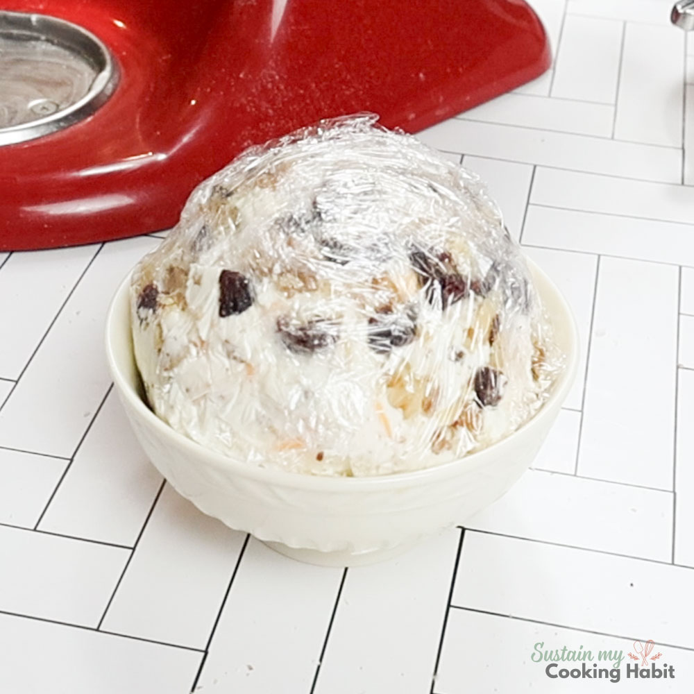 Wrapping cheese ball with plastic wrap.