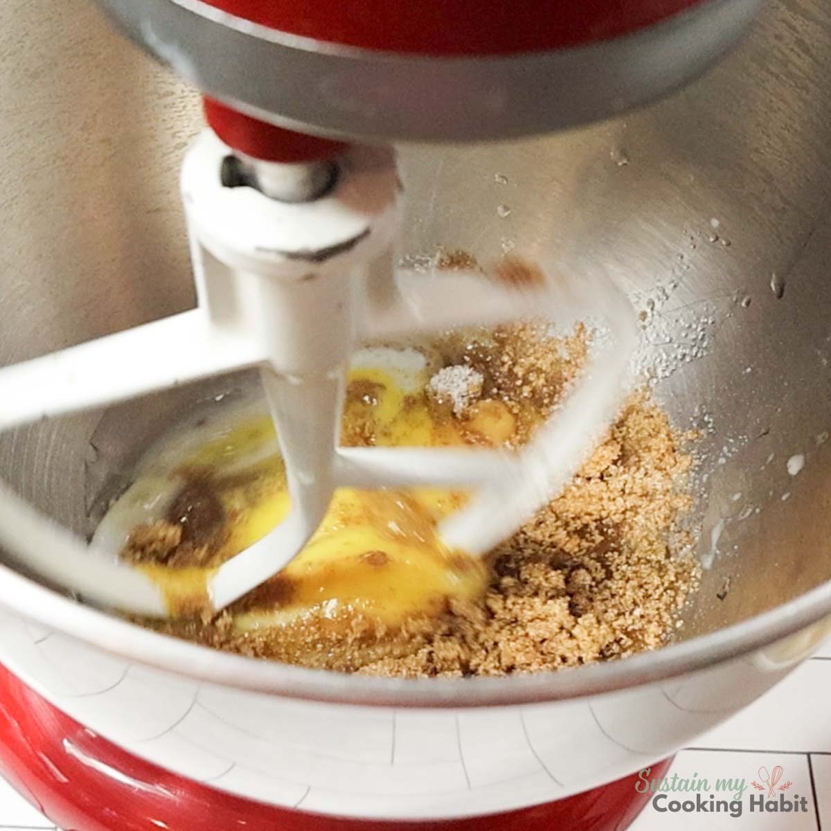 Mixer mixing wet ingredients together.