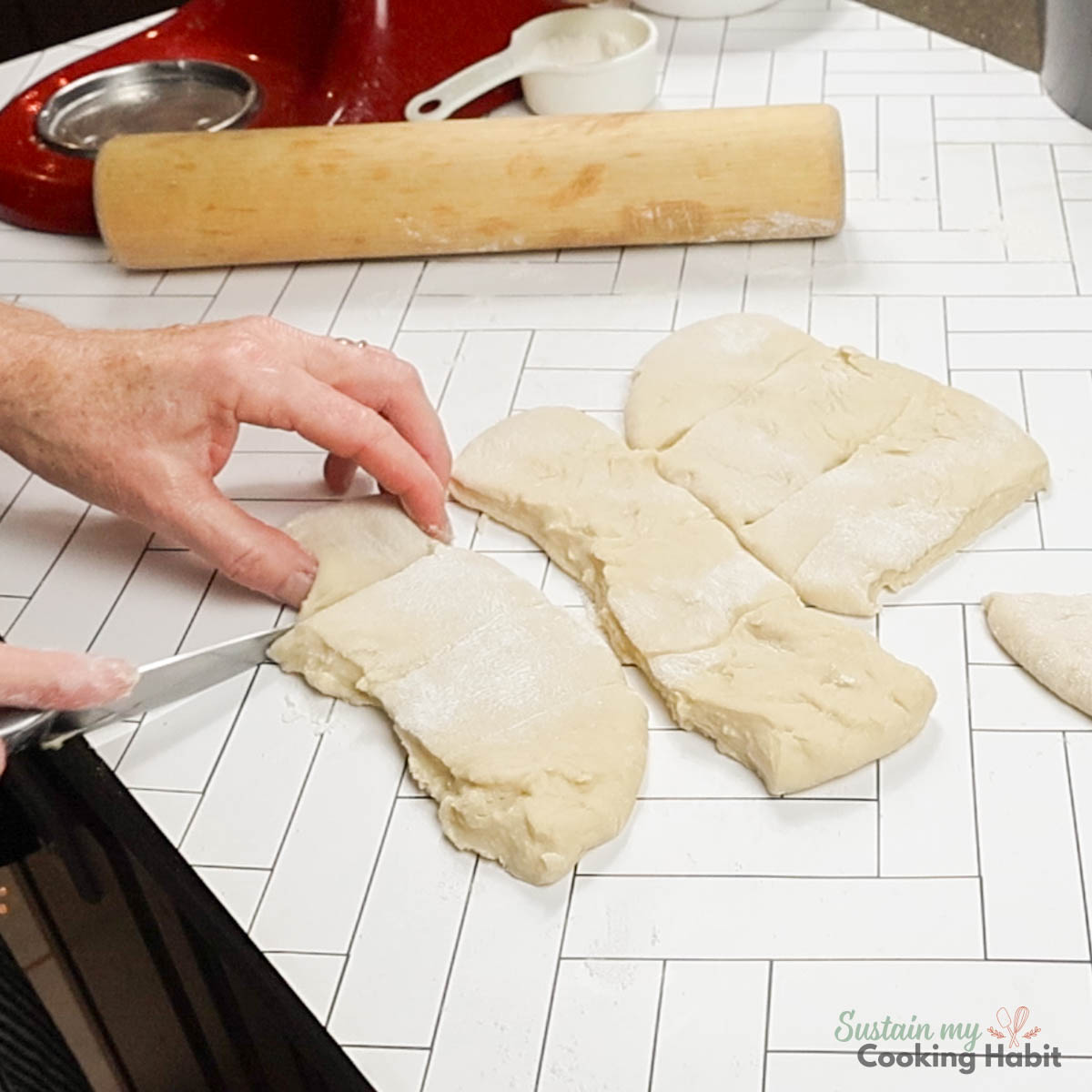 Cutting dough into pieces. 