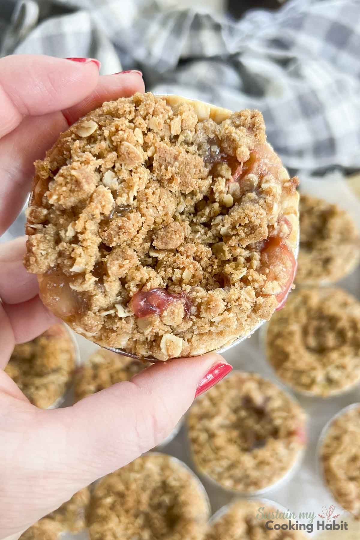 Close up of a rhubarb tart in mini pie shell.