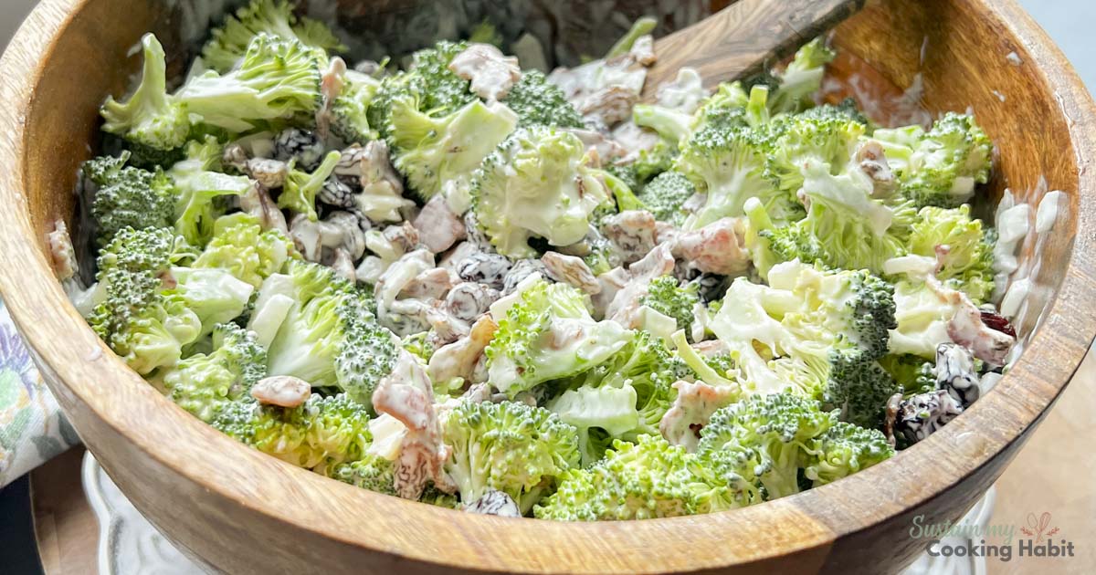 Broccoli and craisin salad in a wood bowl.