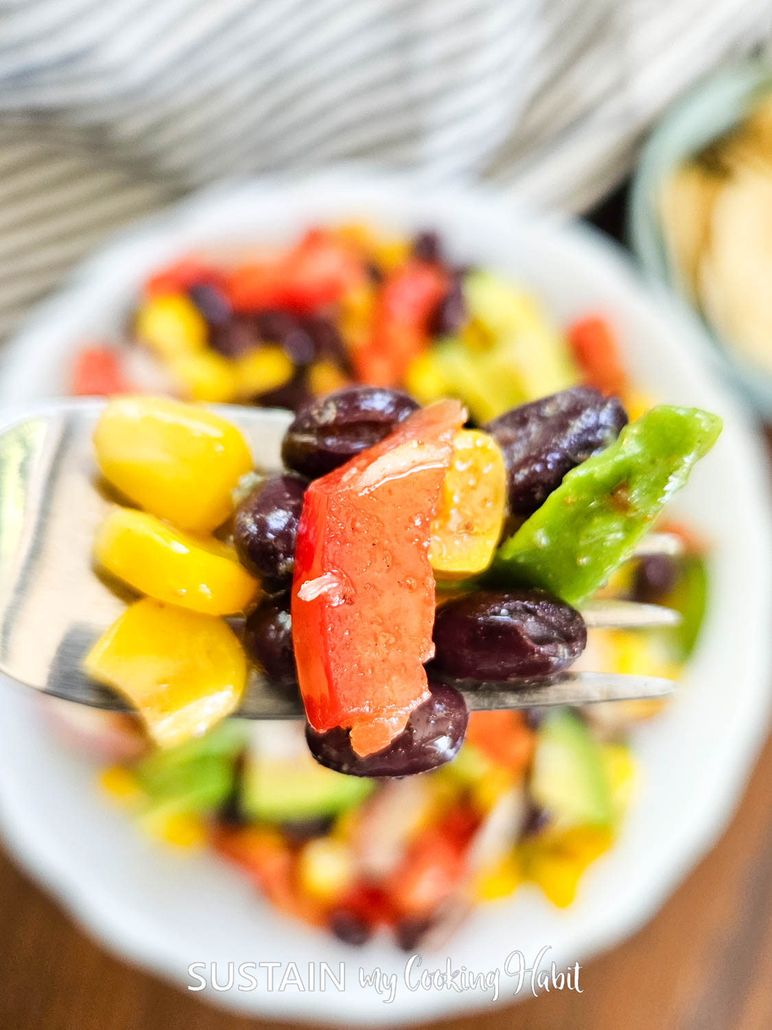 A forkful of black bean and corn salad. 