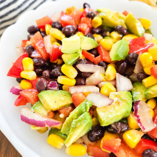 close up of a delicious and colorful black bean, corn, red onions, pepers salad