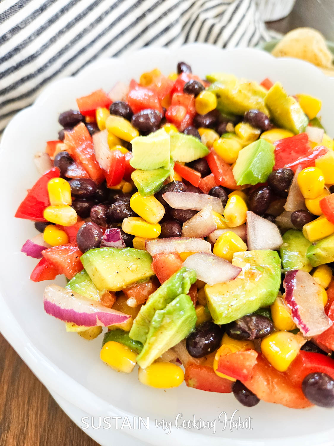 close up of a delicious and colorful black bean, corn, red onions, pepers salad