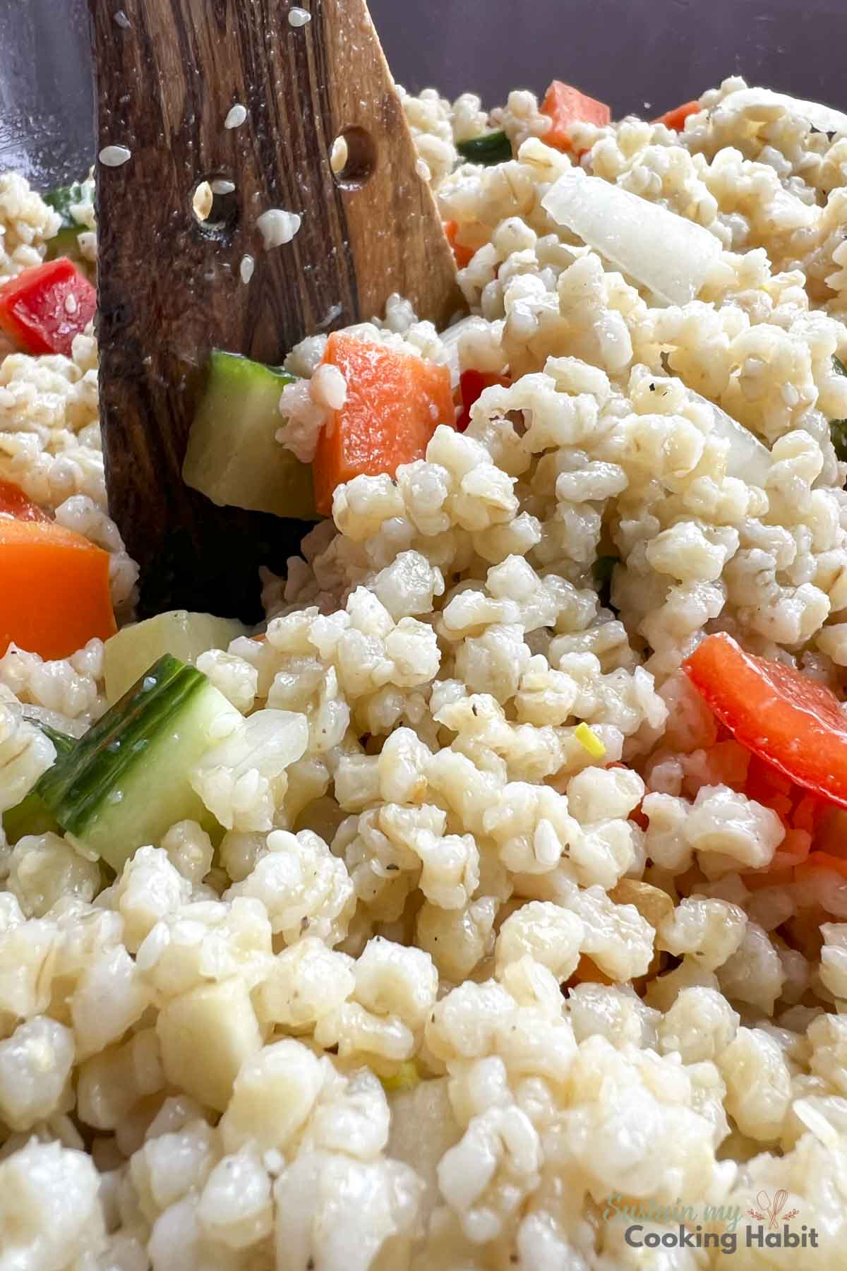 Mixing vegetables and barley.