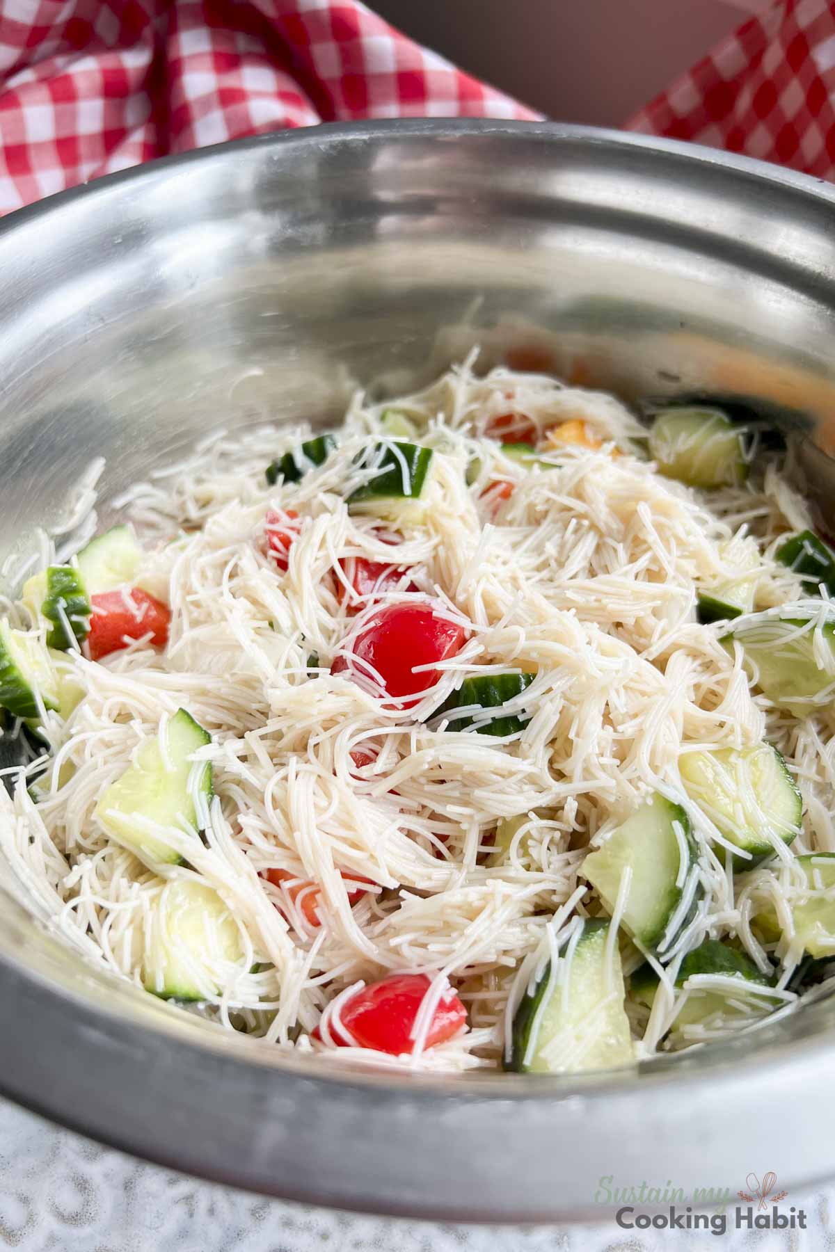 Close up of rice noodle salad with vegetables.