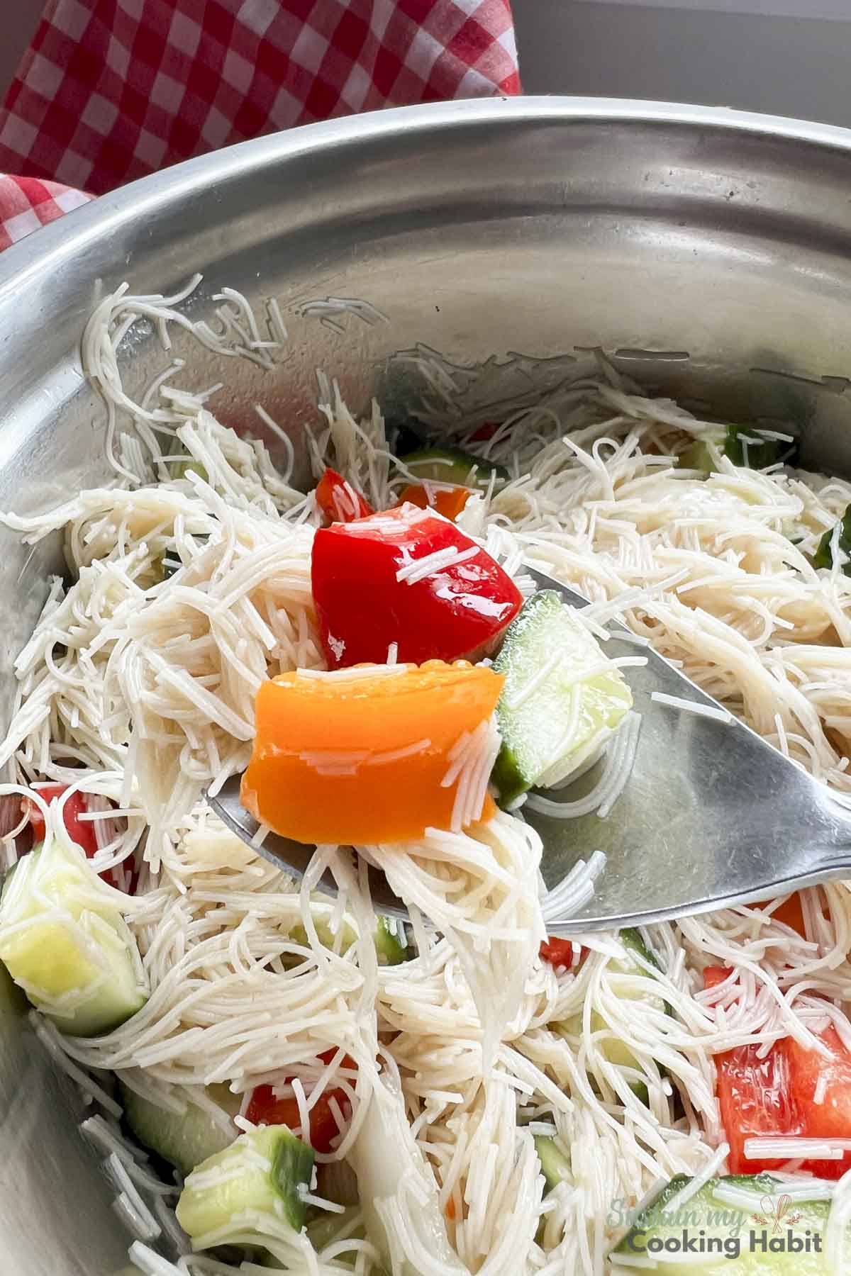 Spoonful of rice noodle salad.