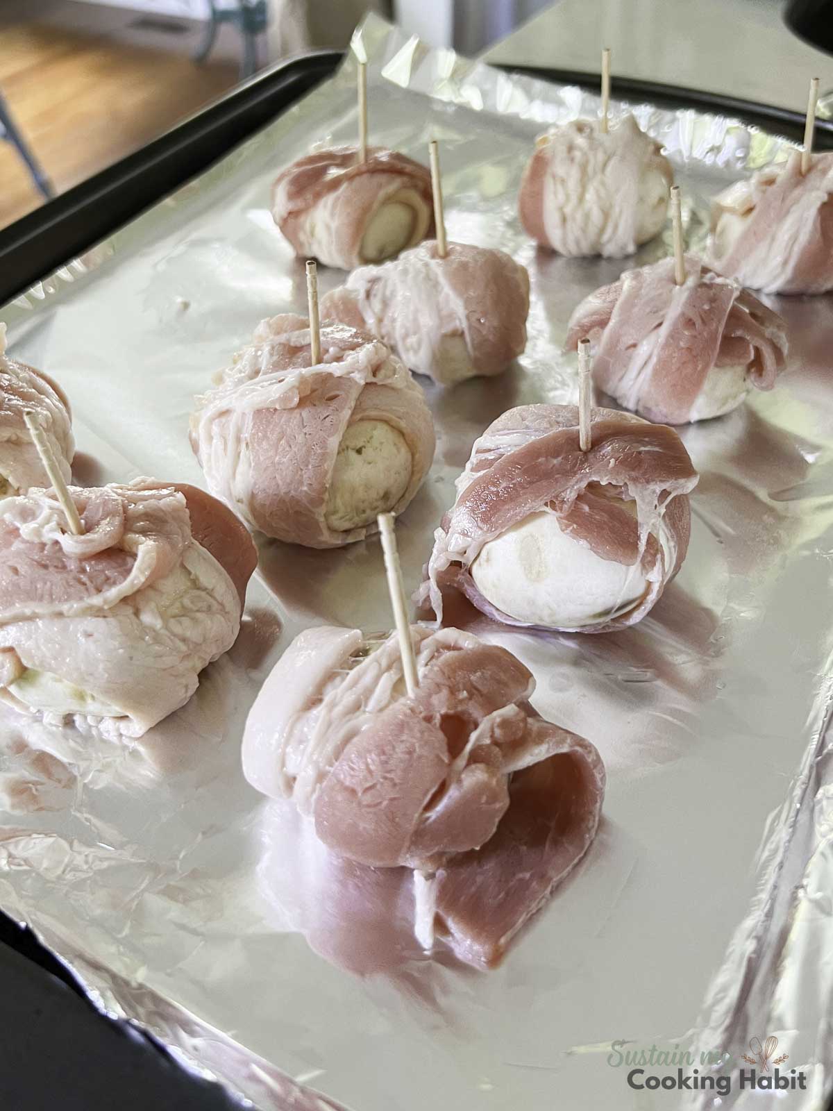 Bacon wrapped mushrooms with toothpicks.