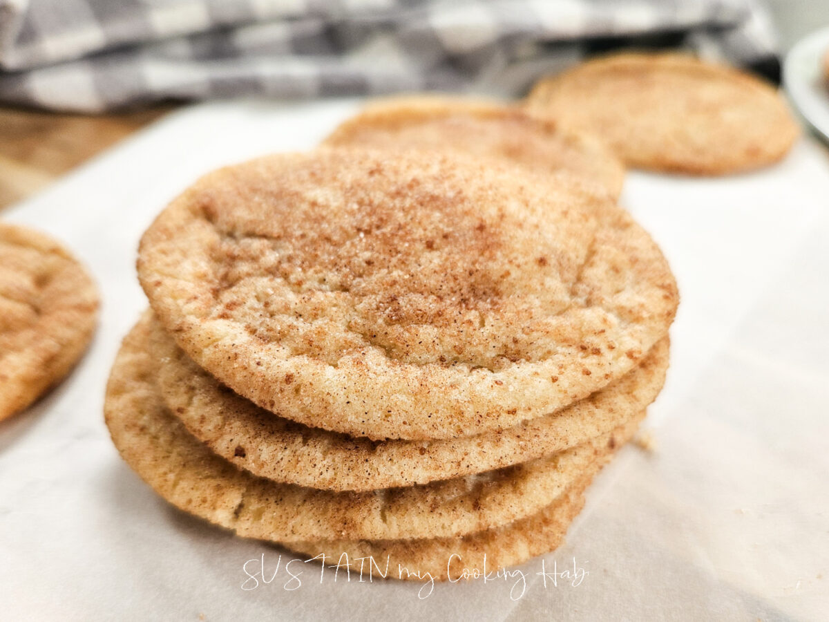 homemade snickerdoodle cookies stacked together.